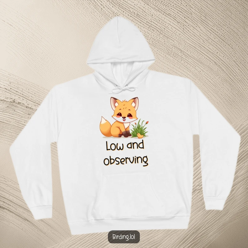 Funny fox cub in a hoodie, crouching low, delighted while observing a creature in a bush.